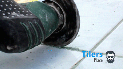 oscillating multi-tool removing grout from tile
