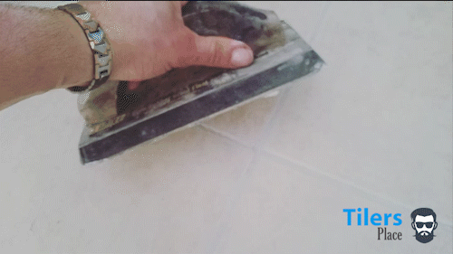 applying grout to tile with a rubber float demonstration