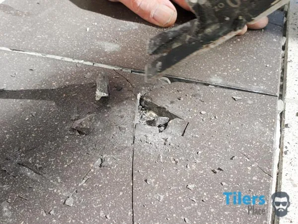 Piece removed from cracked tile