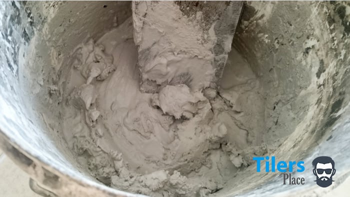Mixing grout in a bucket makes clean up and working easy. 