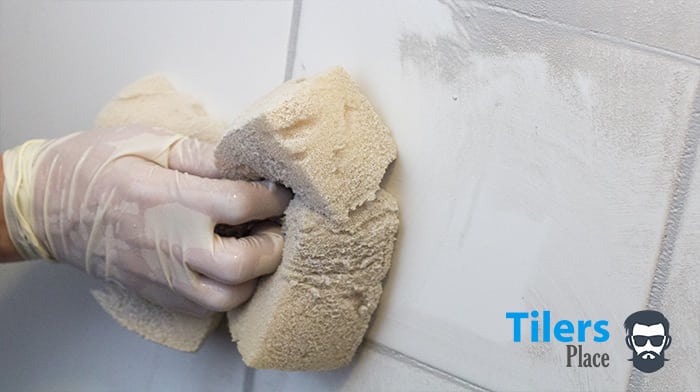 Wipe off the excess grout with your sponge but not not over wet the tiles!