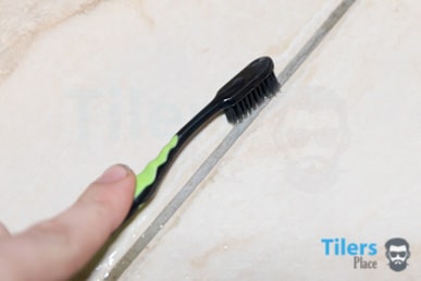 Scrubbing tile grout